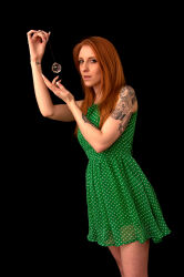  absurdres alexa_red entrancement_uk femdom pendulum real red_hair simple_background tattoo 